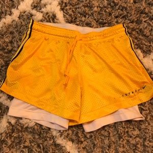 Yellow Nike livestrong running shorts